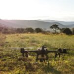 A drone surveying a lush forest, showcasing modern forestry mapping techniques and technology in action.